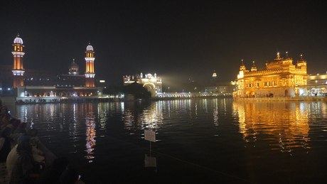 The Golden Temple at night, lit on the water