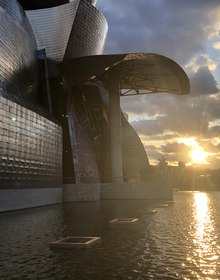 The museum at sunset, the river burning gold