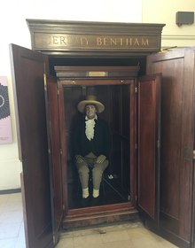 Jeremy Bentham's auto-icon in its cabinet at UCL