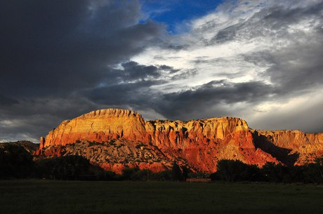 The red cliffs under storm light