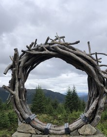 The Viewcatcher, a ring of driftwood on a drystone plinth above the loch