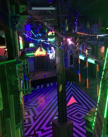 Neon alleyway over a striped violet floor