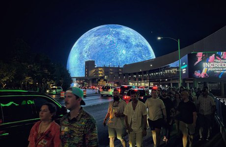 The Sphere lit as the Moon over the street