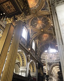 Gilded ceiling mosaics and organ pipes overhead