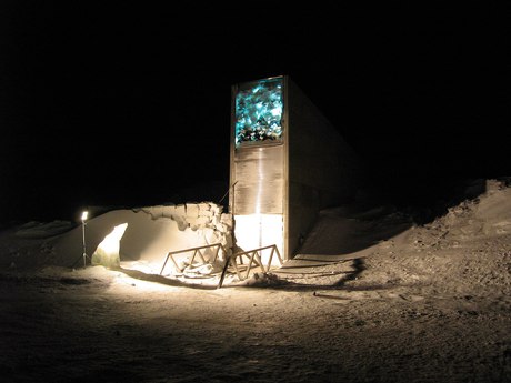 The lit wedge of the vault entrance in the snow